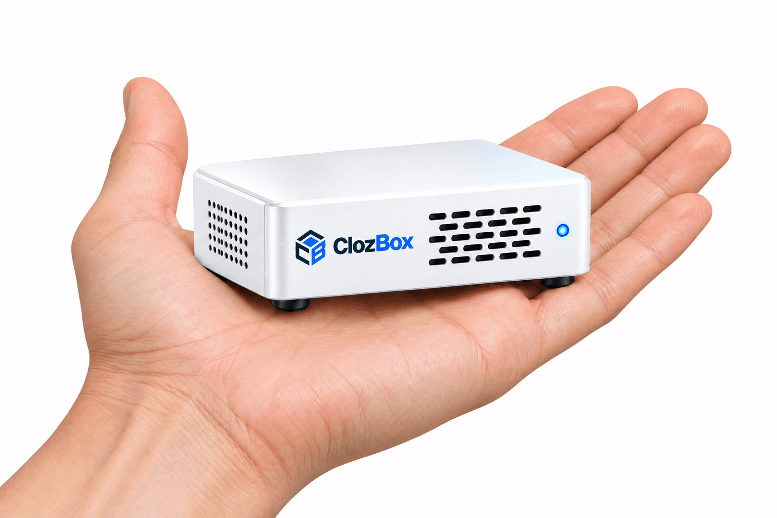 Compact white ClozBox appliance resting in an adult palm for scale
